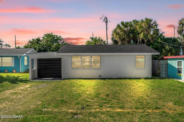 view of front of property with a lawn