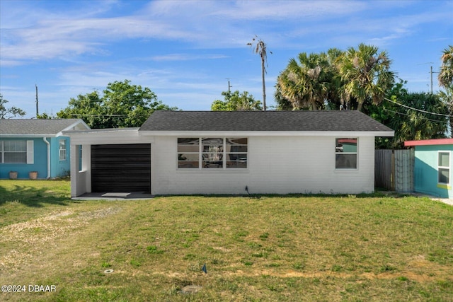 ranch-style home featuring a front yard