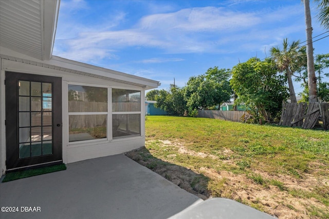 view of yard with a patio and a sunroom