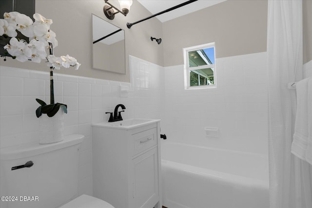 full bathroom with vanity, toilet, tile walls, and shower / bathtub combination with curtain