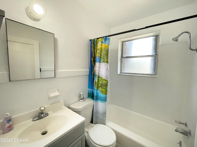 full bathroom with toilet, vanity, and shower / bath combination with curtain