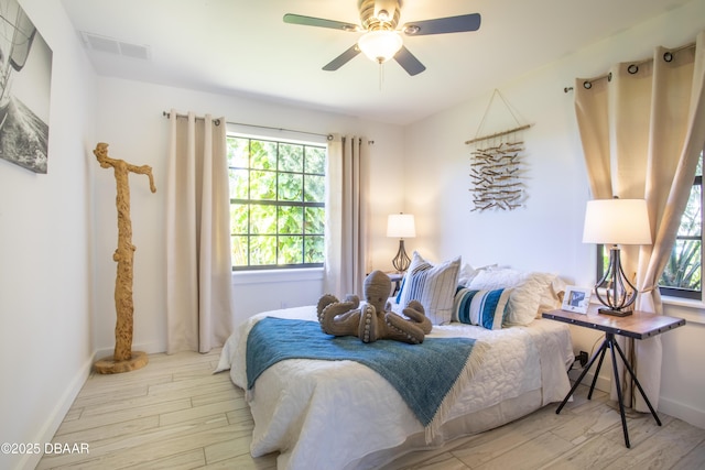 1076 Shockney Dr, Ormond Beach, FL 32174 - bedroom with wood finished floors, baseboards, and ceiling fan