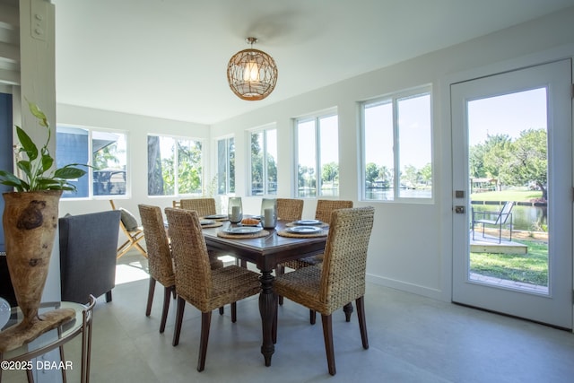 1076 Shockney Dr, Ormond Beach, FL 32174 - dining space featuring healthy amount of natural light, a chandelier, and baseboards
