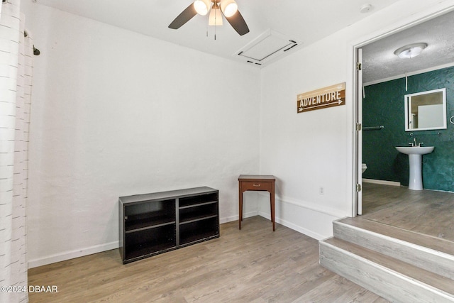 unfurnished room featuring hardwood / wood-style flooring and ceiling fan