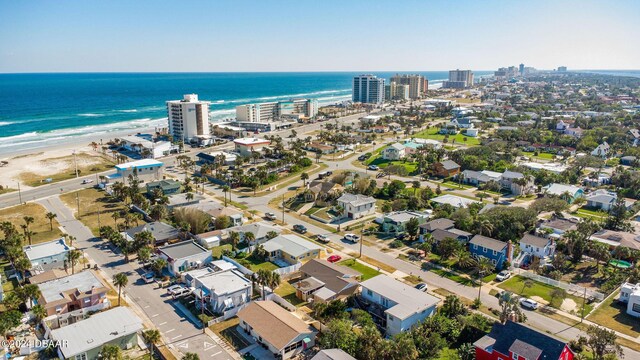 bird's eye view featuring a water view and a view of the beach