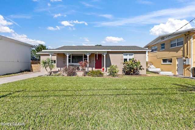 view of front of house featuring a porch and a front lawn