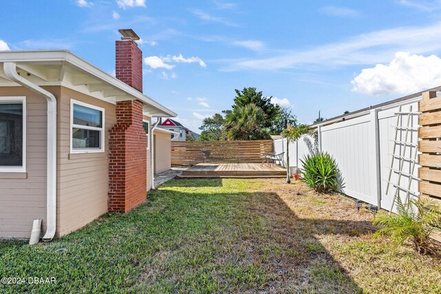 view of yard with a deck