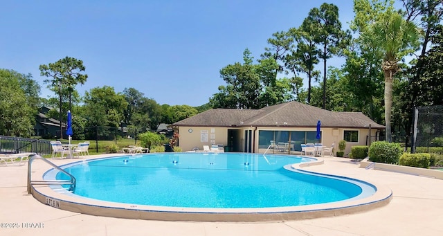 146 Deer Lake Cir, Ormond Beach, FL 32174 - community pool with a patio area and view of scattered trees