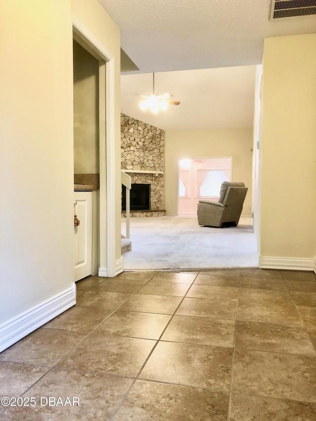 146 Deer Lake Cir, Ormond Beach, FL 32174 - corridor featuring tile patterned flooring, carpet, and baseboards
