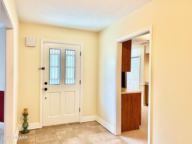 146 Deer Lake Cir, Ormond Beach, FL 32174 - entrance foyer with light tile patterned floors and a textured ceiling