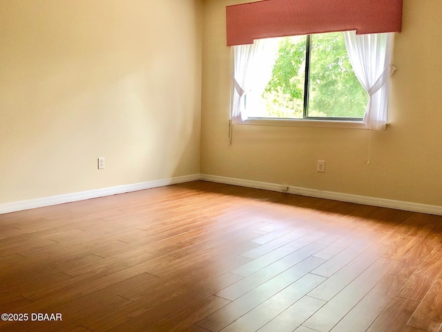 146 Deer Lake Cir, Ormond Beach, FL 32174 - spare room featuring baseboards and wood finished floors