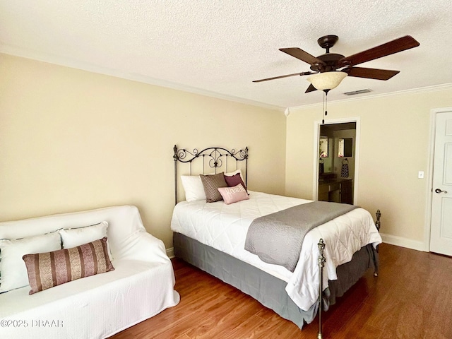 146 Deer Lake Cir, Ormond Beach, FL 32174 - bedroom featuring wood finished floors, ornamental molding, a ceiling fan, and a textured ceiling