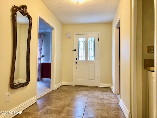 146 Deer Lake Cir, Ormond Beach, FL 32174 - entryway featuring a textured ceiling and baseboards