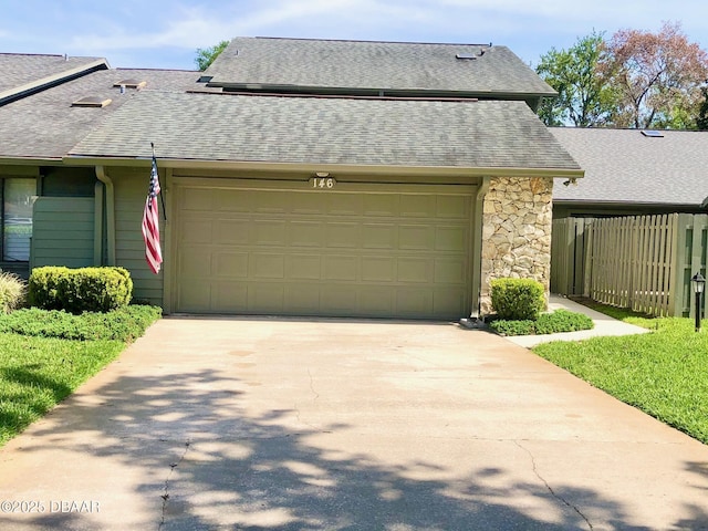 146 Deer Lake Cir, Ormond Beach, FL 32174 - view of front facade featuring a shingled roof, a garage, stone siding, and concrete driveway