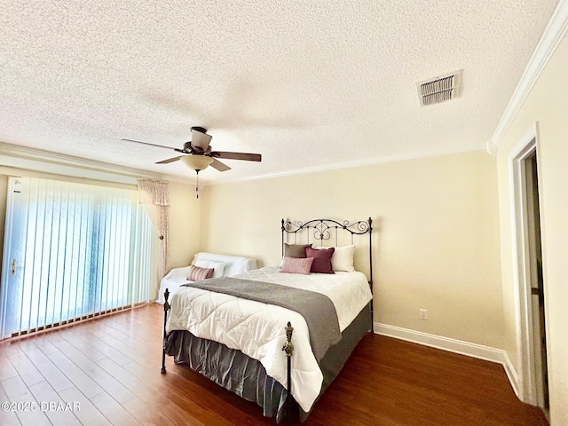 146 Deer Lake Cir, Ormond Beach, FL 32174 - bedroom with crown molding, wood finished floors, a textured ceiling, and a ceiling fan