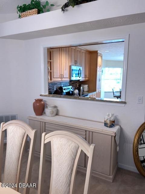 bar with range and decorative backsplash