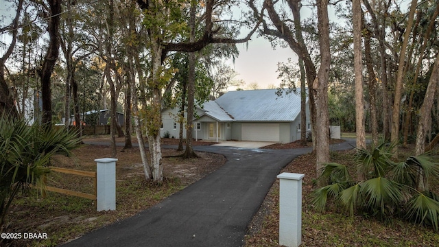 view of front of property with a garage