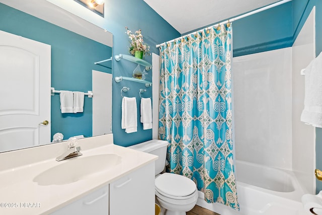 full bathroom featuring vanity, shower / bath combination with curtain, and toilet