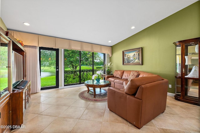 tiled living room with vaulted ceiling