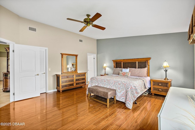 bedroom with wood-type flooring, lofted ceiling, and ceiling fan