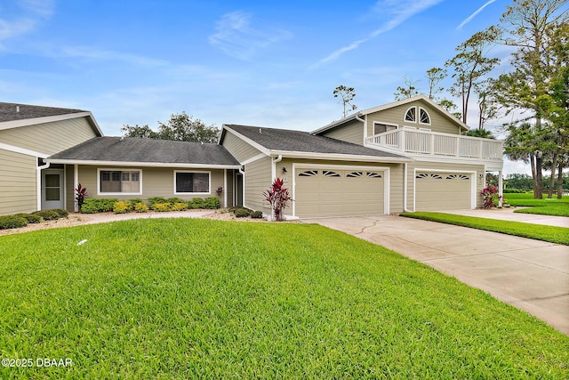 view of front of house featuring a garage, a front lawn, and a balcony