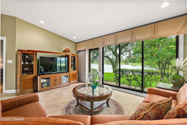 tiled living room with lofted ceiling