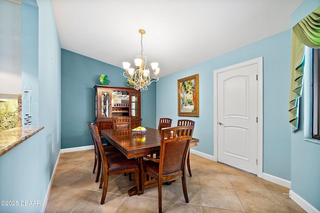 dining room featuring light tile patterned floors and a chandelier