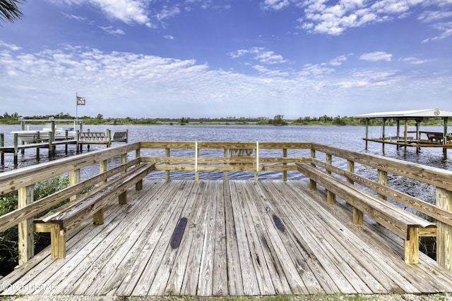 9 San Jose Cir, Ormond Beach, FL 32176 - dock featuring boat lift and a water view