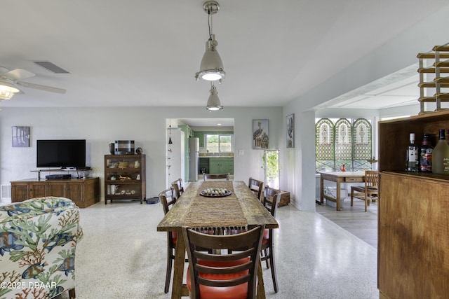 9 San Jose Cir, Ormond Beach, FL 32176 - dining area featuring dark speckled floor and ceiling fan