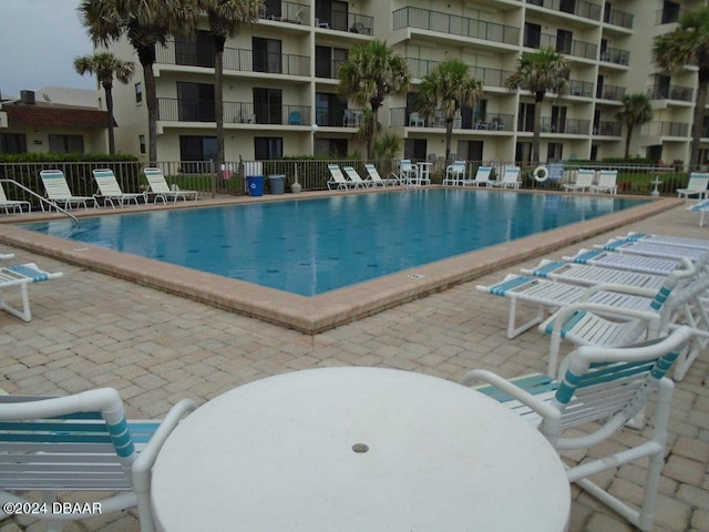 2700 Ocean Shore Blvd Unit 108, Ormond Beach, FL 32176 - community pool with a patio area
