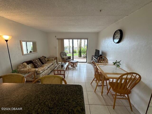 tiled living room with a textured ceiling