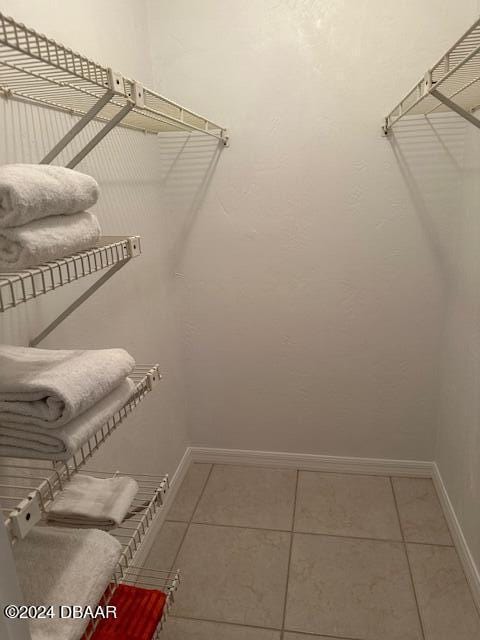 2700 Ocean Shore Blvd Unit 108, Ormond Beach, FL 32176 - spacious closet featuring tile patterned flooring