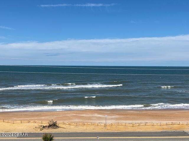 view of water feature with a beach view