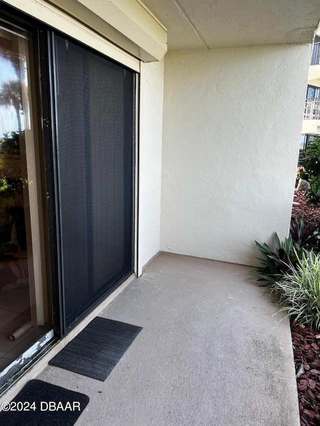 2700 Ocean Shore Blvd Unit 108, Ormond Beach, FL 32176 - view of exterior entry with stucco siding