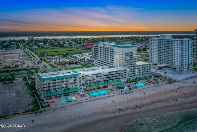 aerial view at dusk with a water view