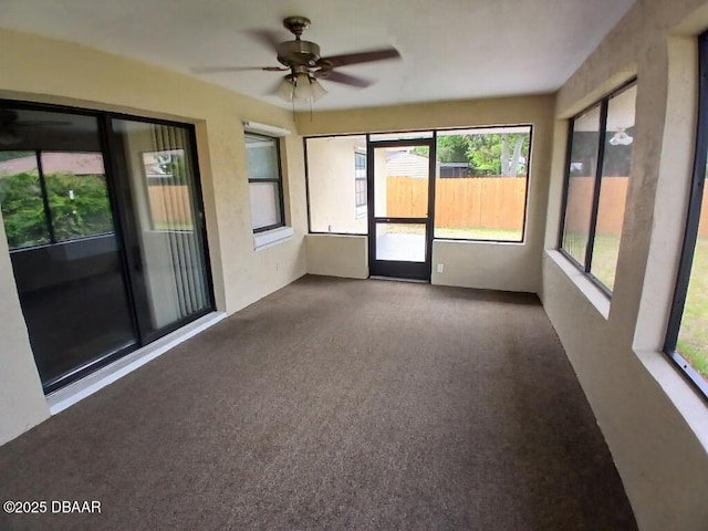 unfurnished sunroom with a wealth of natural light