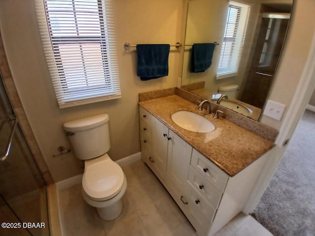full bathroom with toilet, baseboards, a shower stall, tile patterned floors, and vanity