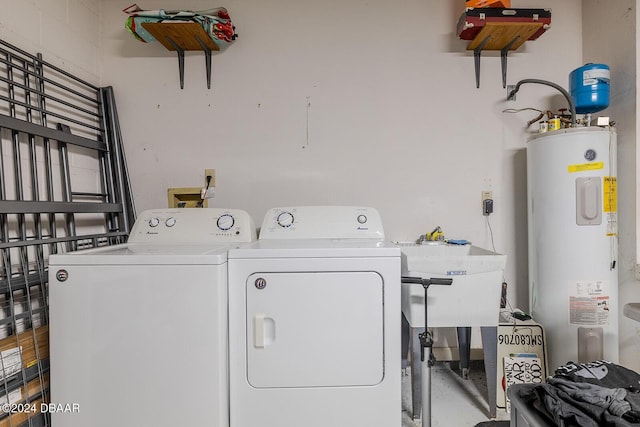 74 Fulton Pl, Palm Coast, FL 32137 - washroom featuring electric water heater, washer and clothes dryer, and a sink