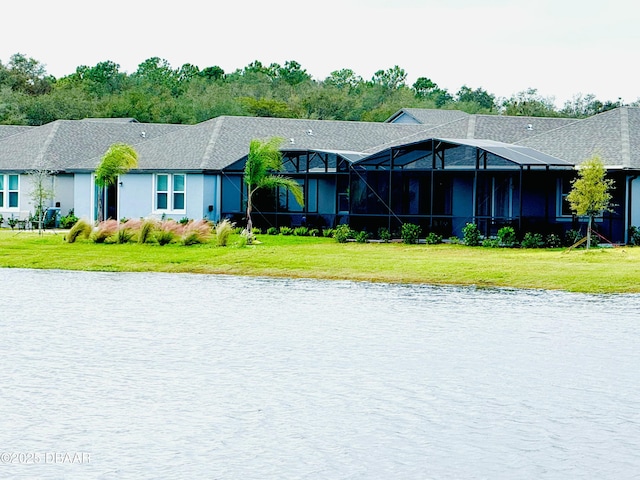 129 Lost Ball Dr, Daytona Beach, FL 32124 - view of front of house with a water view, a front lawn, and glass enclosure