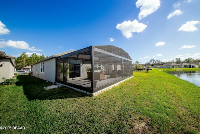 129 Lost Ball Dr, Daytona Beach, FL 32124 - back of property with a lawn, a lanai, and a water view