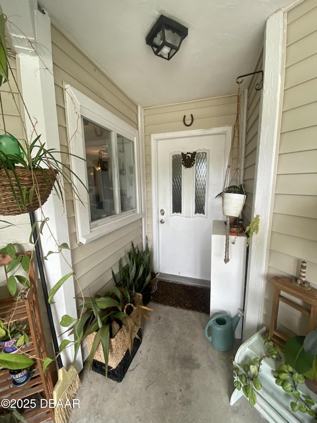 doorway to property with a porch