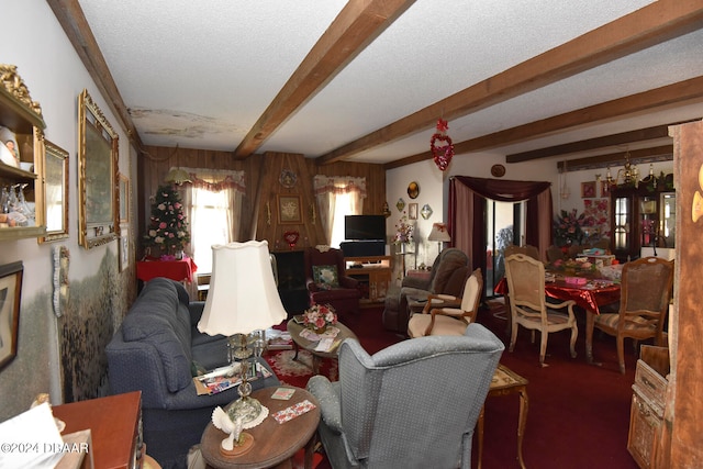 living room featuring beamed ceiling, dark carpet, and a textured ceiling