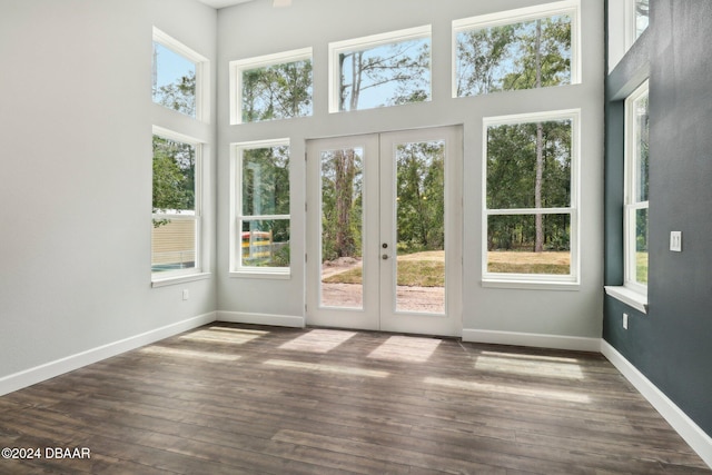 unfurnished sunroom with french doors