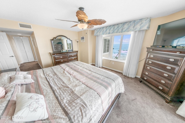 carpeted bedroom with ceiling fan