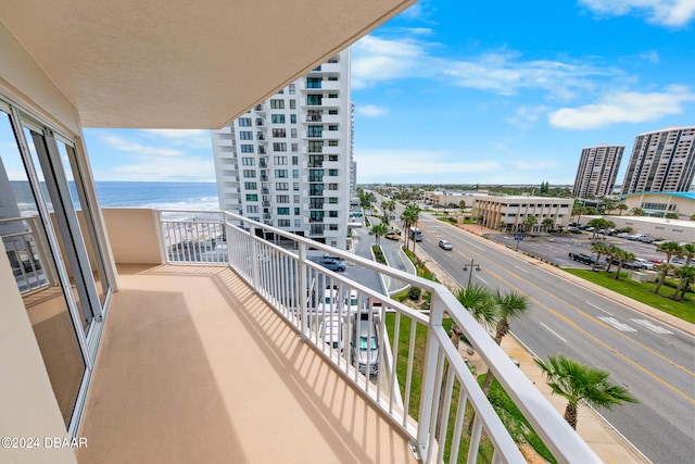 balcony featuring a water view