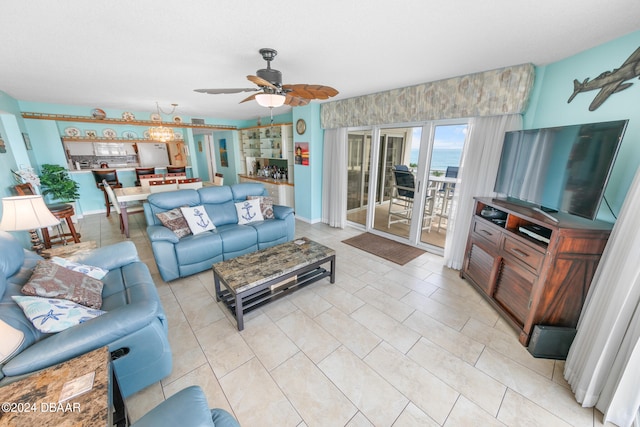 tiled living room with ceiling fan