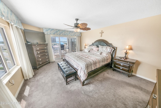 carpeted bedroom featuring ceiling fan, a textured ceiling, and access to outside