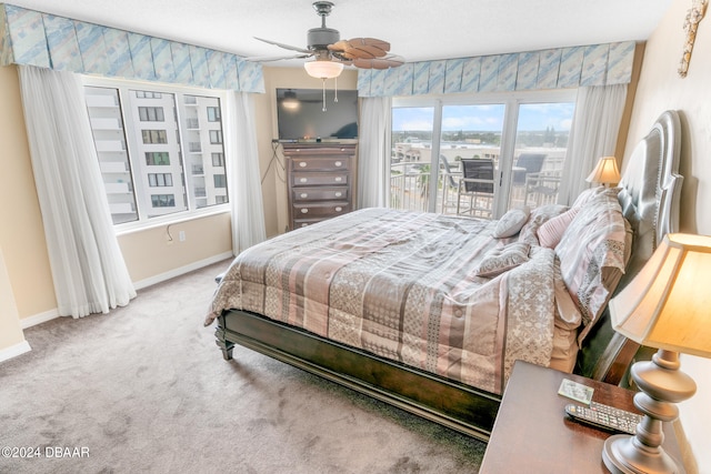 bedroom featuring access to exterior, carpet, and ceiling fan