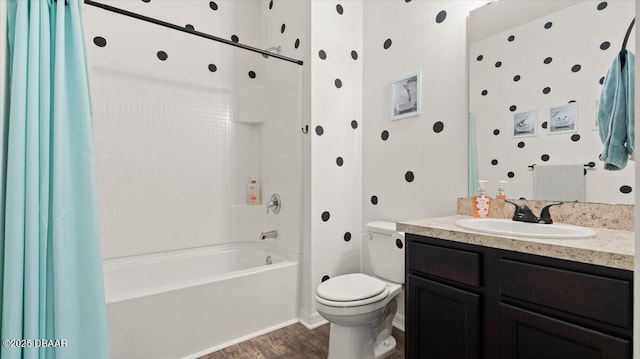 full bath with vanity, toilet, shower / tub combo, and wood finished floors