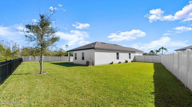 view of yard featuring cooling unit and a fenced backyard